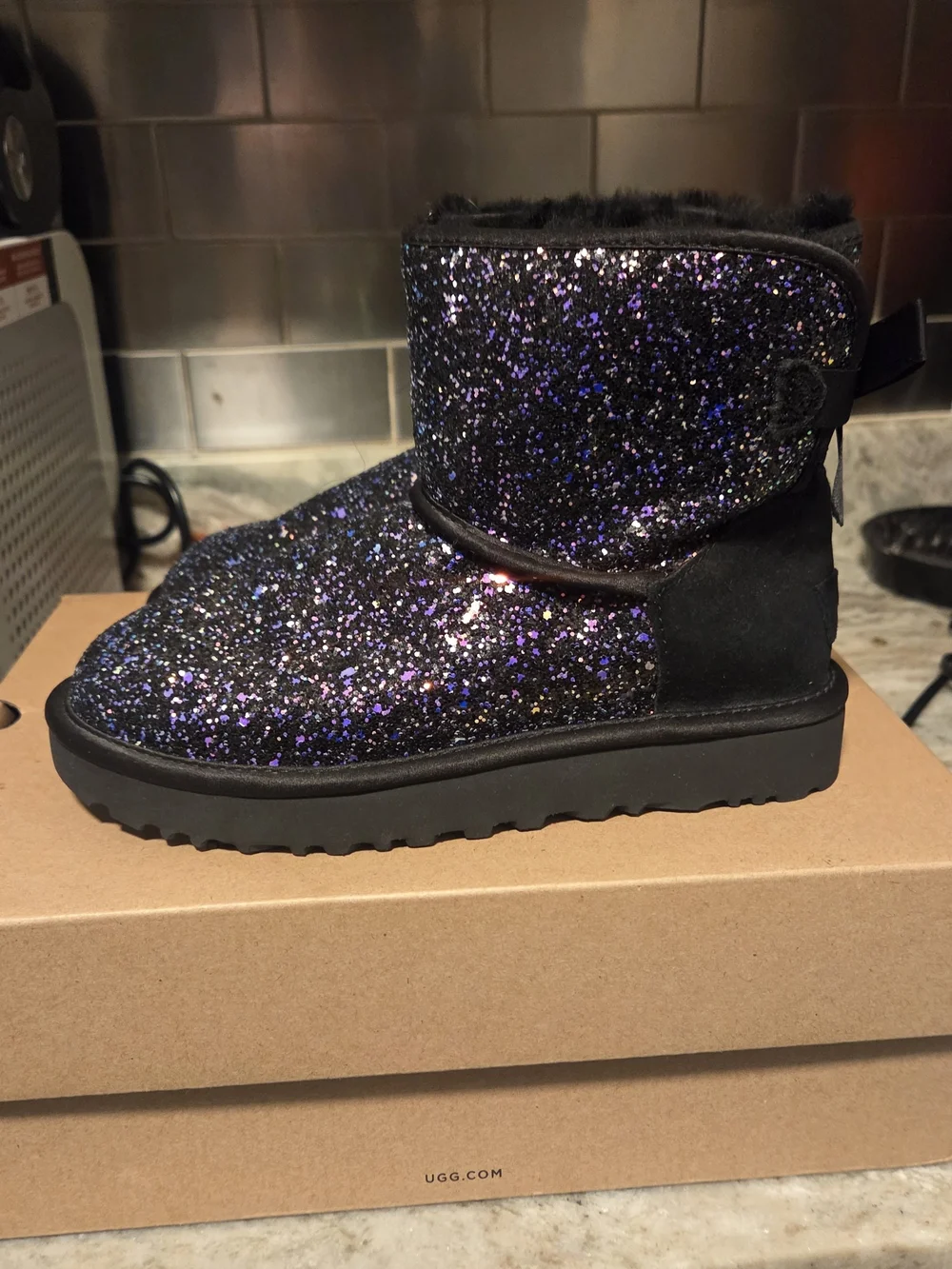 UGG Kids Glitter Boot in Black with Purple Sparkle